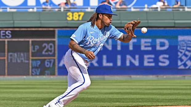 Apr 10, 2022; Kansas City, Missouri, USA; Kansas City Royals shortstop Adalberto Mondesi (27) fields a ground ball during the seventh inning against the Cleveland Guardians at Kauffman Stadium. Mandatory Credit: Peter Aiken-USA TODAY Sports